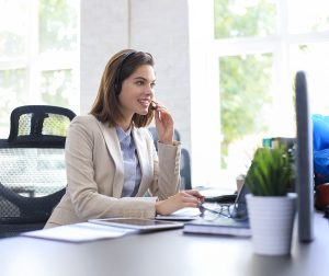 Consultant assisting client with UAE Golden Visa eligibility assessment on computer